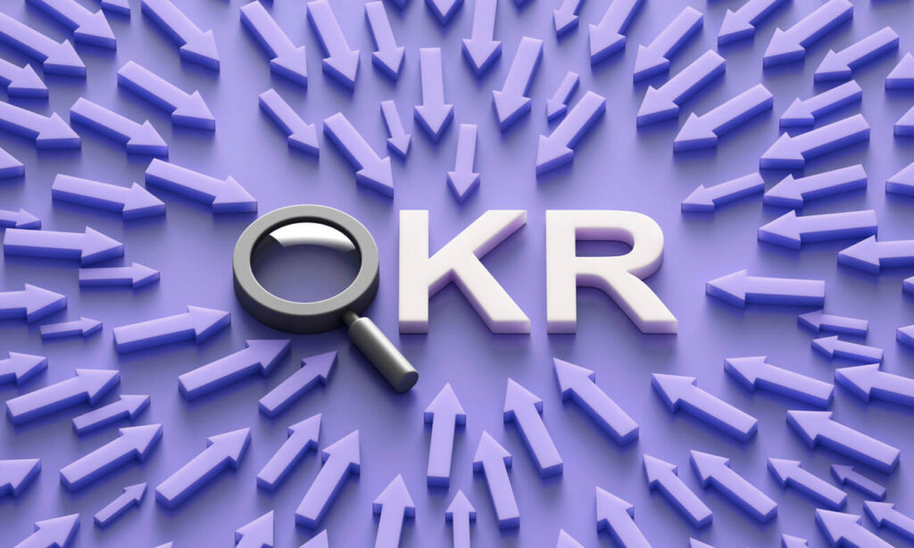 3D illustration of the acronym OKR surrounded by arrows.